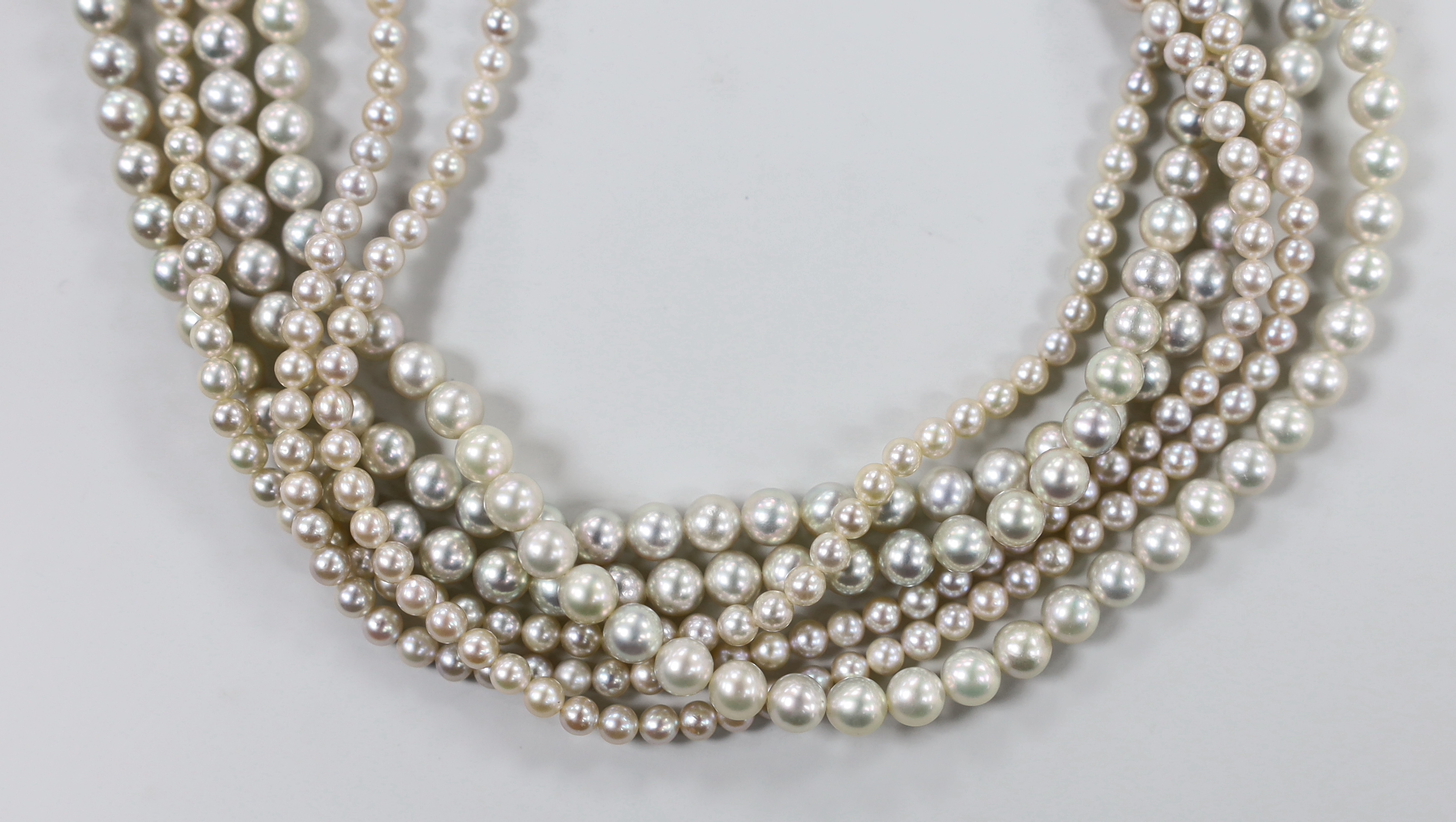 A modern multi-strand graduated cultured pearl choker necklace, with 9ct white metal clasp, 36cm.